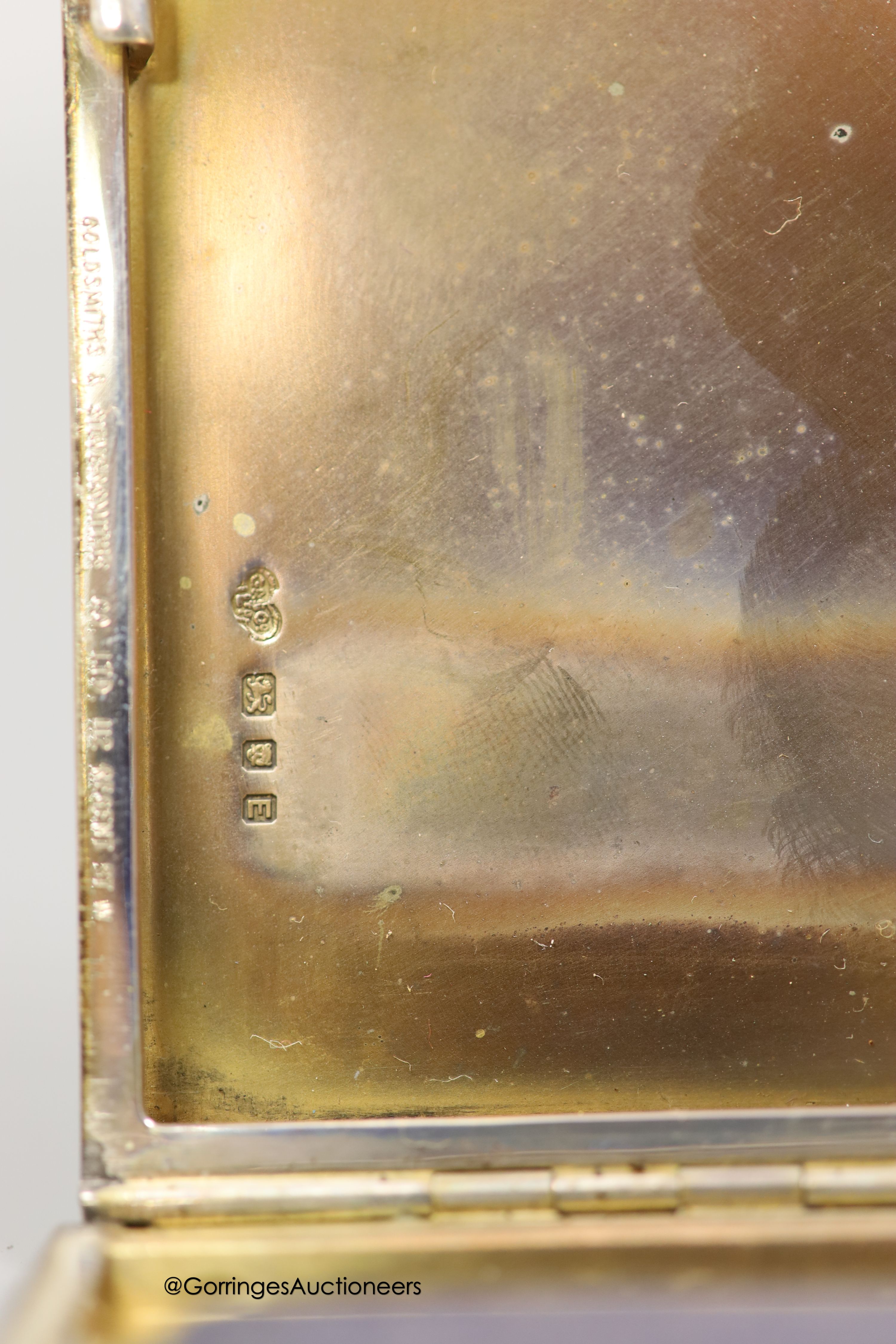 A George VI engine turned silver rectangular cigarette case, Goldsmiths & Silversmiths Co Ltd, London, 1940, 12.3cm and one other smaller silver cigarette case, gross 8.5oz.